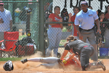 Lauren Waid attempts to tag a Central Florence runner as she slides into home.